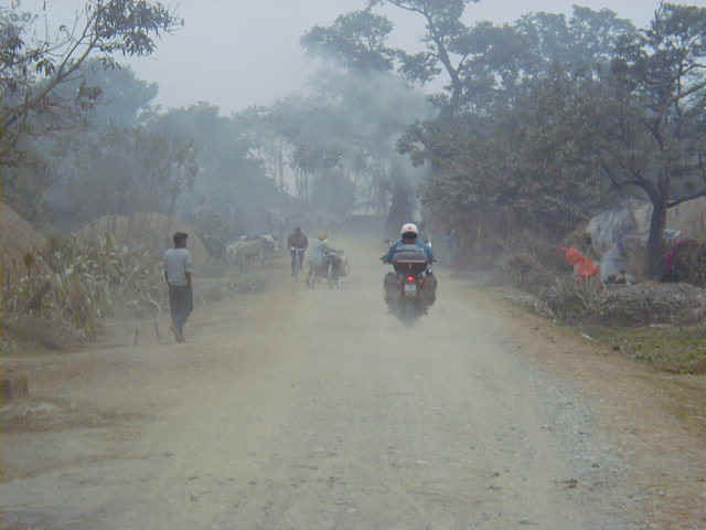 Riding through a remote village